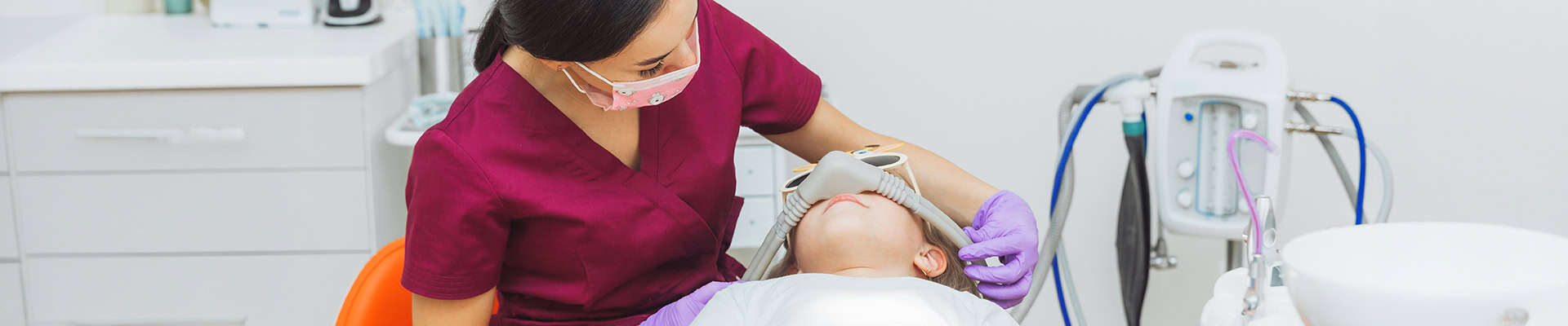Child At Dentist With Nitrous Oxide Sedation Mask Treatment