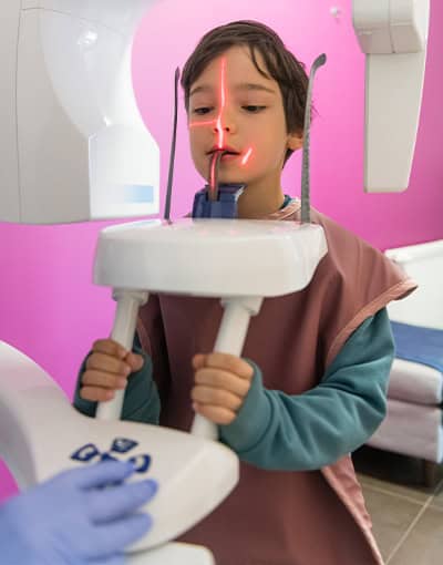 Child Getting Dental Xray Scan At Dentist