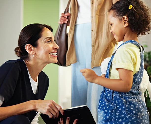 Child Greeting Dentist At Clinic Reception
