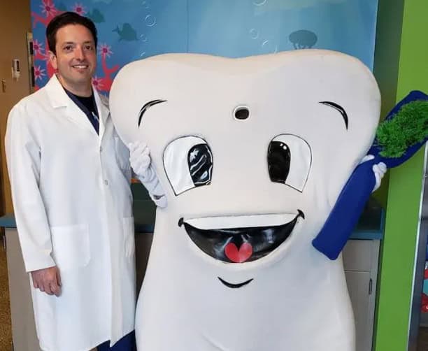 Dentist With Tooth Mascot Brushing Teeth Children Dentistry